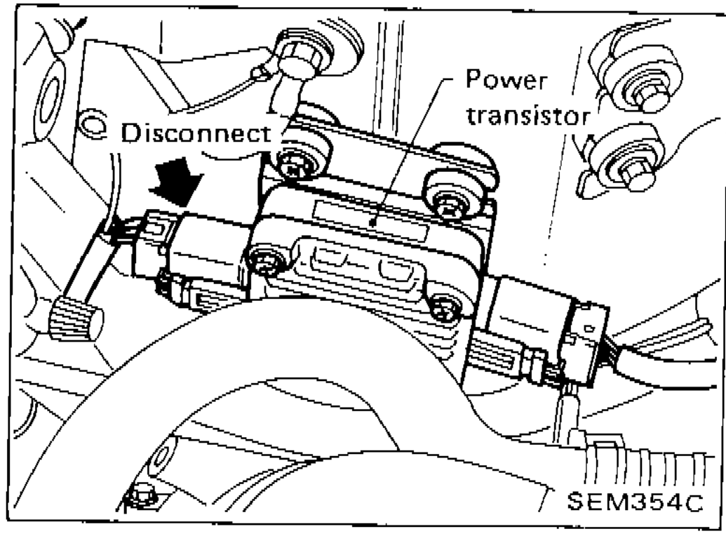 Photo showing the power transistor harness connector being disconnected from the engine bay