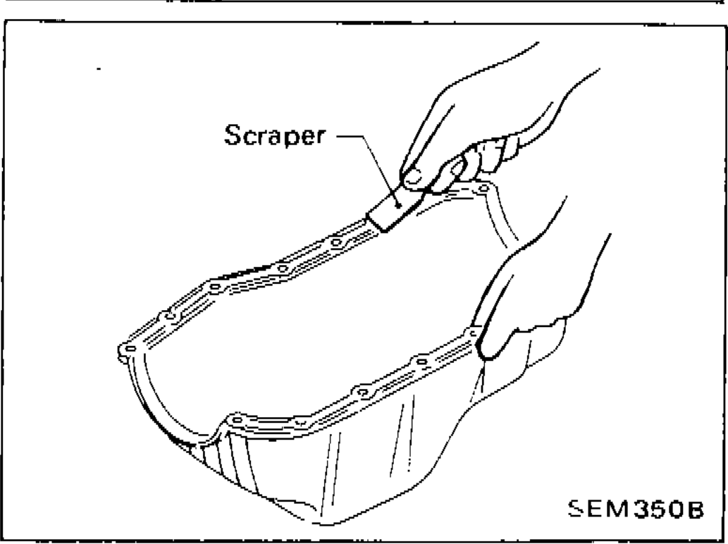 Scraper being used to remove liquid gasket from oil pan mating surface