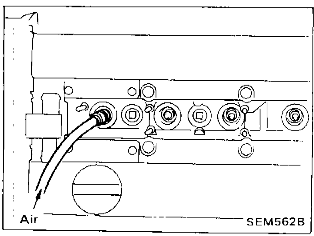 Illustration showing air hose adapter installed into spark plug hole for valve oil seal replacement, with Air label
