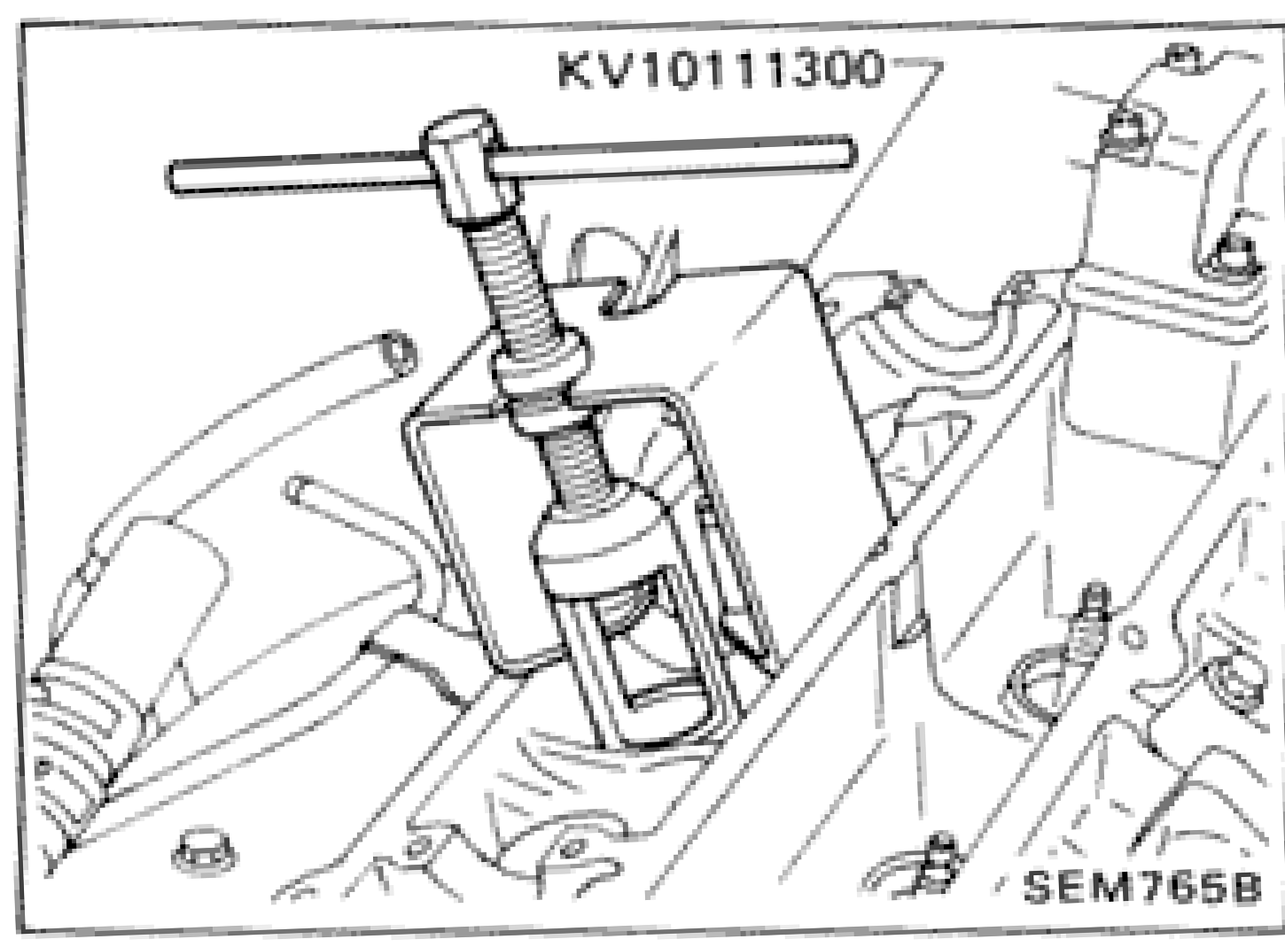 Tool KV10111300 being used to compress valve spring on cylinder head