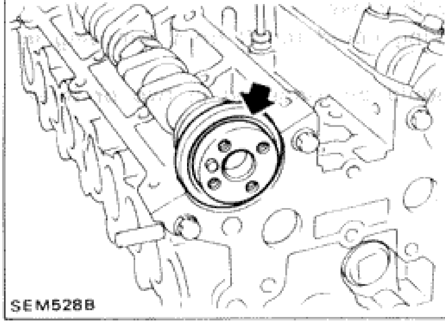 Photograph showing removal of oil seals, camshafts and hydraulic valve lifters with arrow indicating component