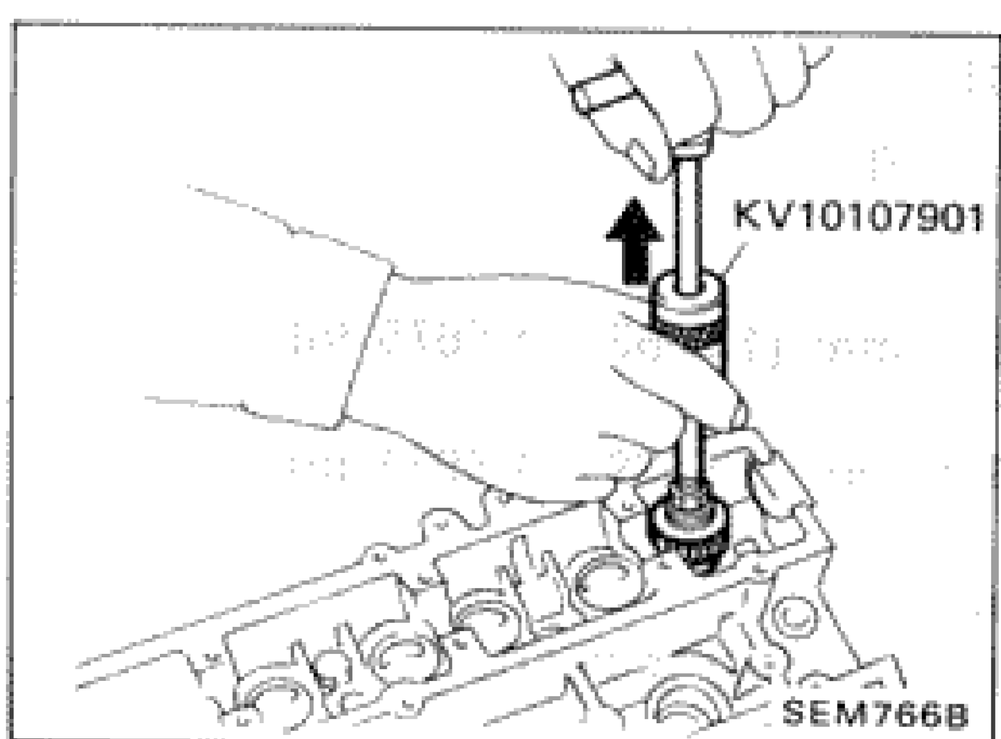 Illustration showing removal of valve oil seals using tool KV10107901