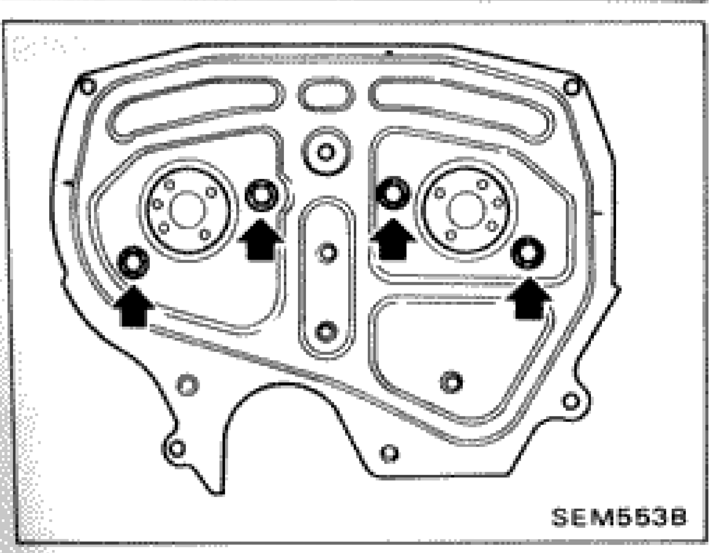 Rear timing cover installation showing arrow indicators for proper installation