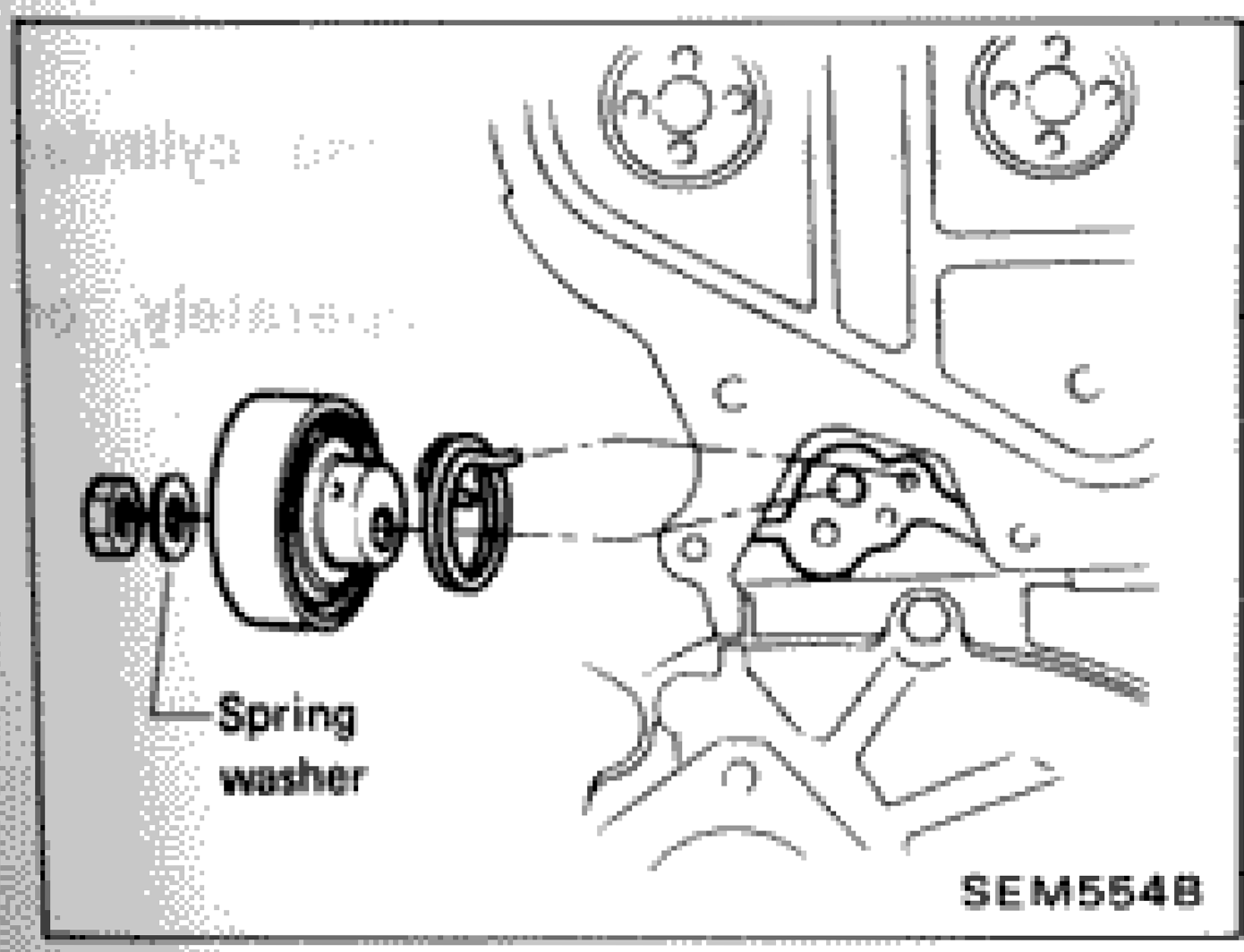 Timing belt tensioner installation showing spring washer location