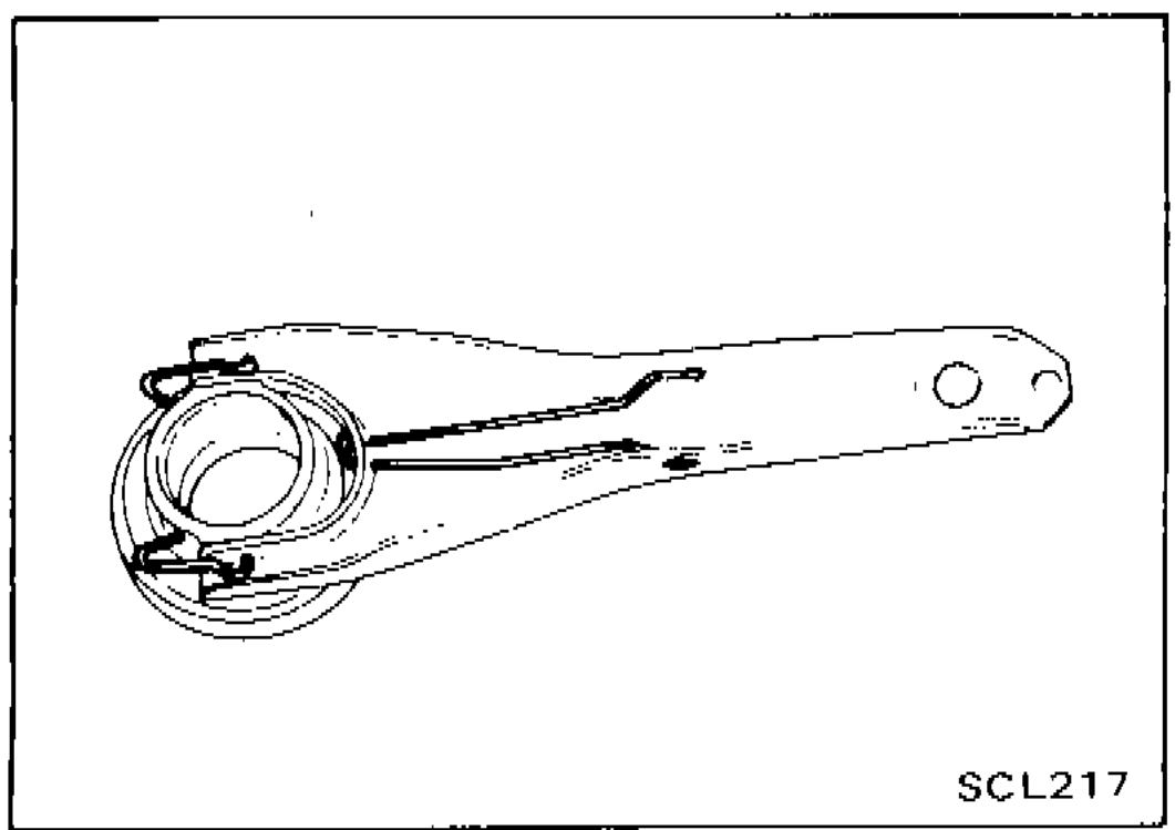 Photo showing withdrawal lever with release bearing assembly, illustrating installation of retainer spring and holder spring.