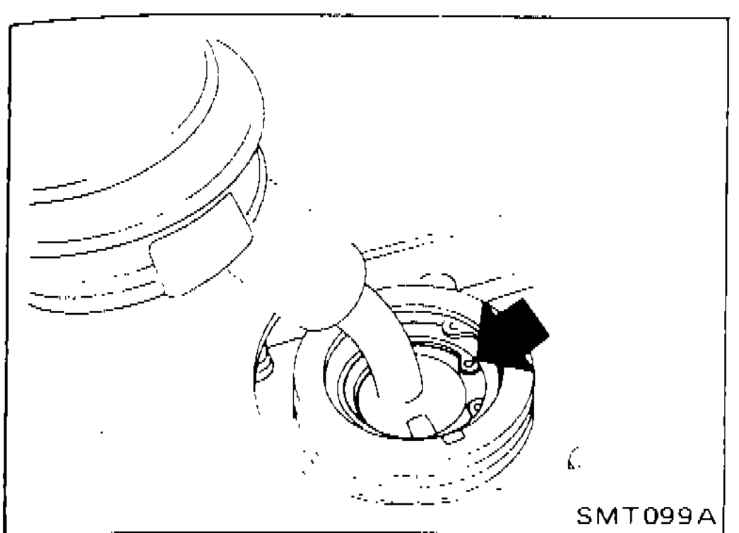 Photograph showing removal of shift lever from inside vehicle