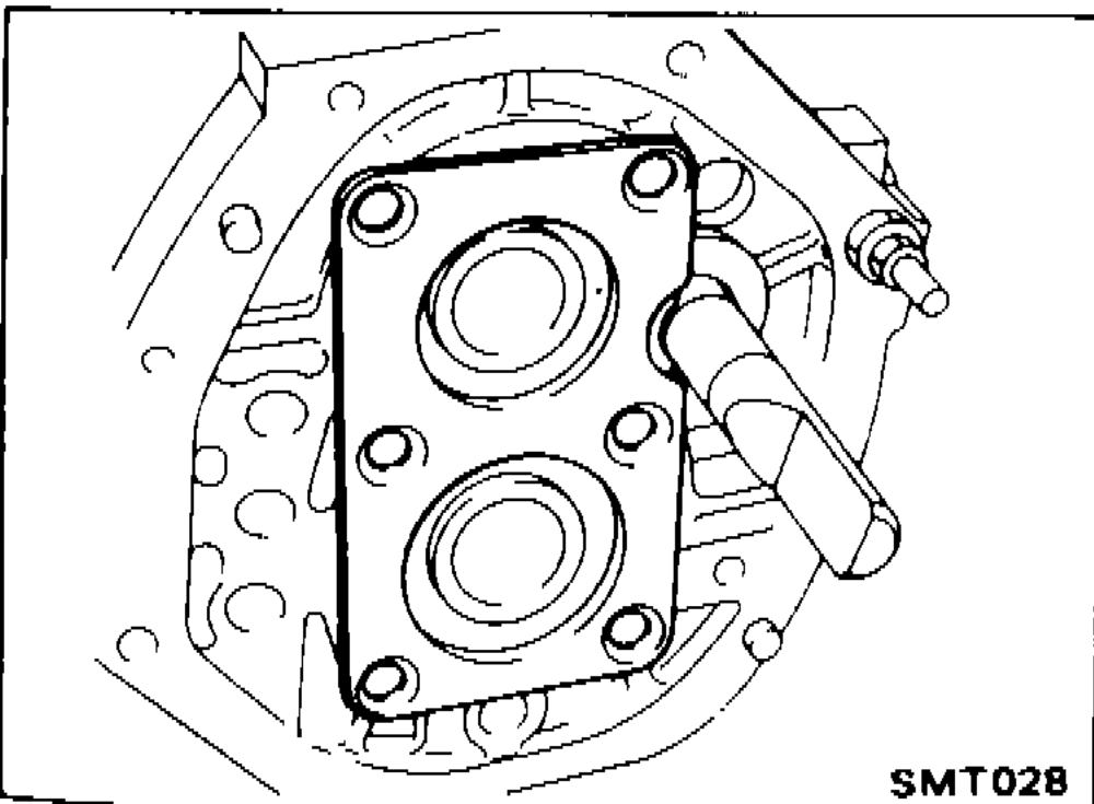 Photograph showing bearing retainer installed on adapter plate with reverse shaft inserted.