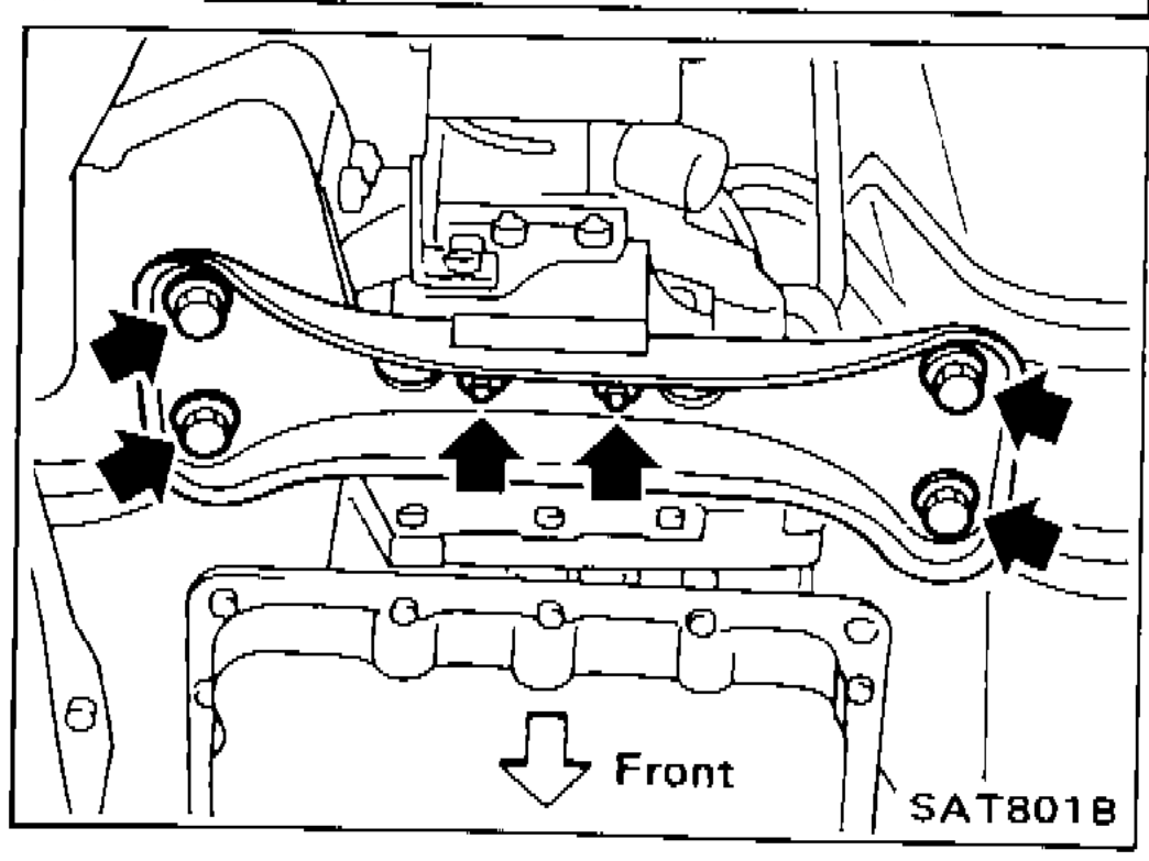 Rear engine mounting member removal from A/T assembly, showing bolt locations with arrows, front orientation indicated