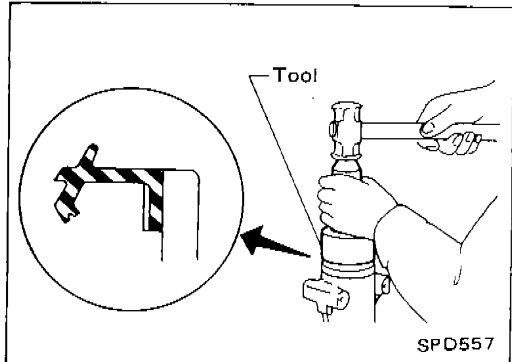 Tool KV38100500 being used to install front oil seal into differential carrier